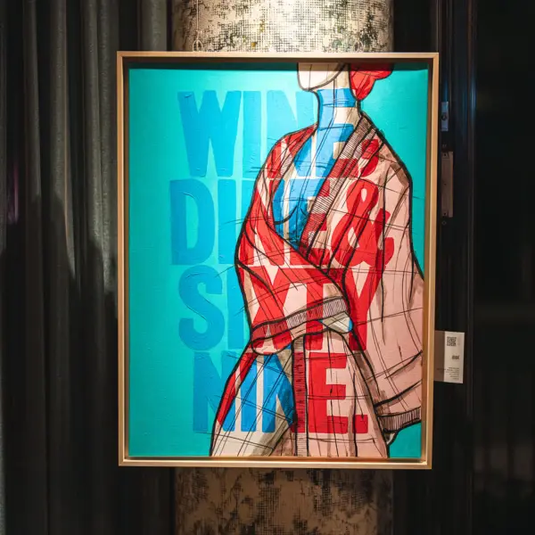 Ein abstraktes, buntes Bild mit der Aufschrift "Wine, dine and sixty nine."